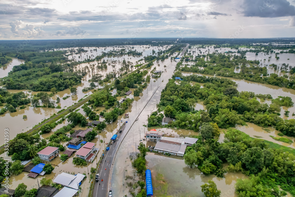 High-angle view of the Great Flood, Meng District, Thailand, on October 3, 2022, is a photograph from real flooding. With a slight color adjustment
