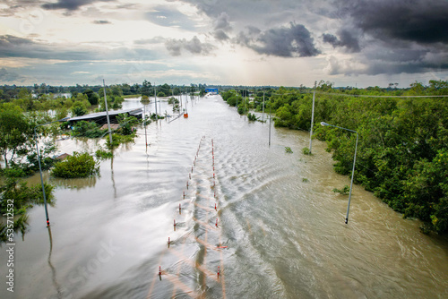 High-angle view of the Great Flood, Meng District, Thailand, on October 3, 2022, is a photograph from real flooding. With a slight color adjustment
