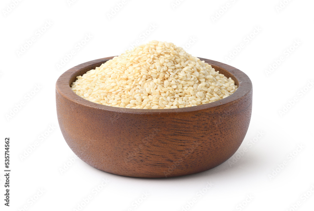 White sesame seeds with wooden bowl isolated on white background. Clipping path. White sesame seeds with wooden bowl isolated on white background. Clipping path.