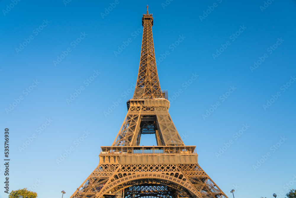 Eiffel Tower close up view in afternoon light in Paris. France