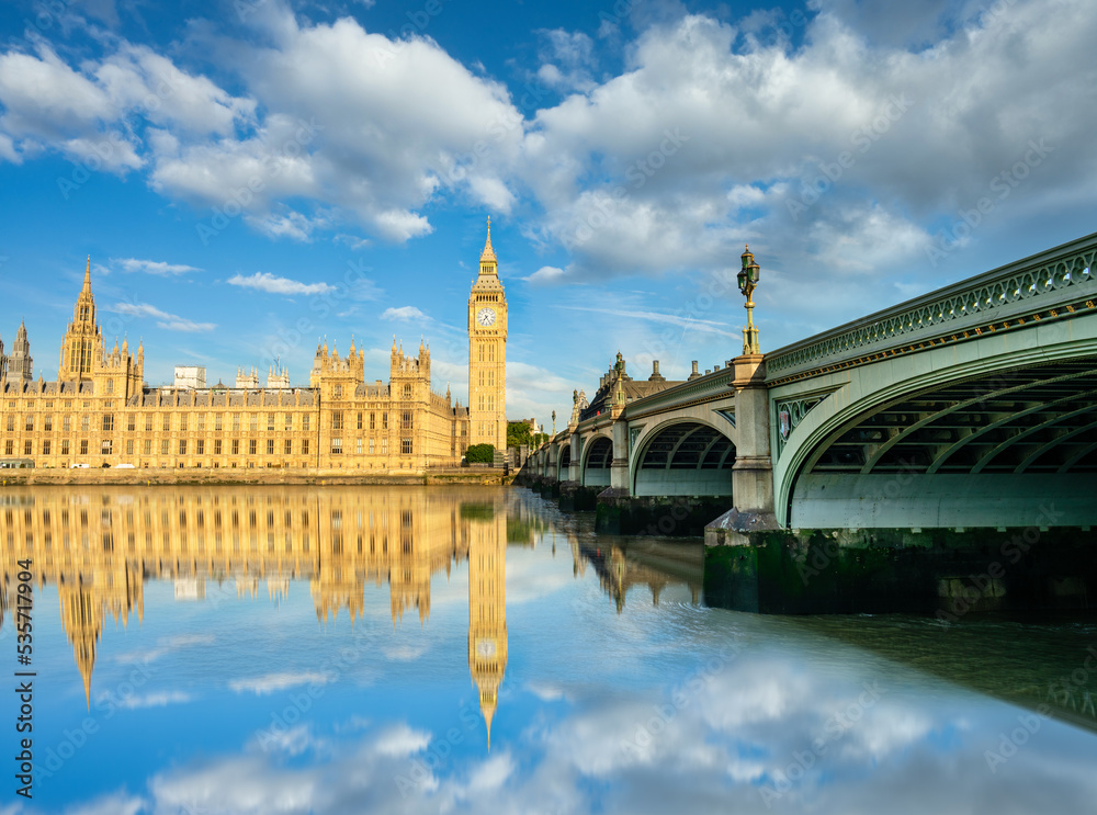 Big Ben and Westminster bridge in London with reflection in river Thames. England
