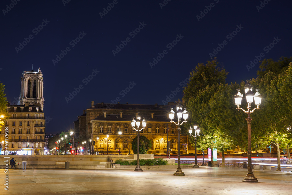 Courtyard of the Paris City Hall overlooking Notre Dame cathedral at night