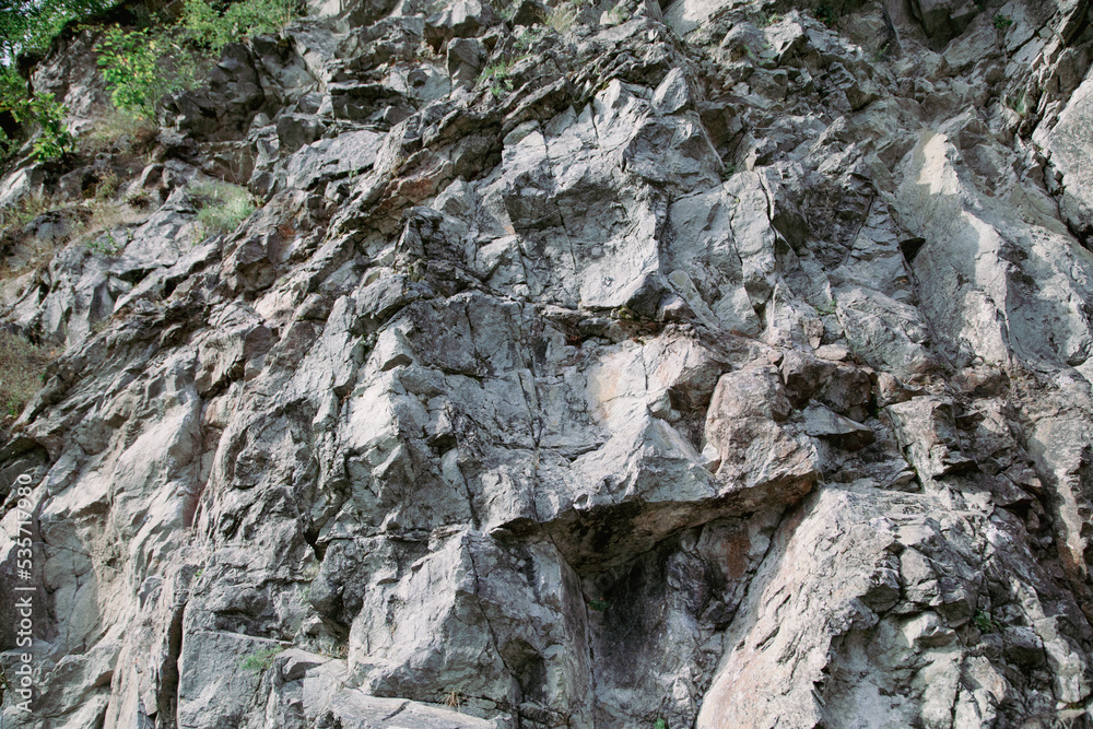 Stone rocks on the mountain as background.