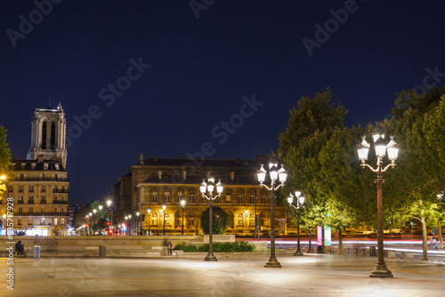 Courtyard of the Paris City Hall overlooking Notre Dame cathedral at night