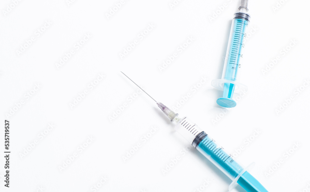 Medical syringe on a white background. A syringe for injection. The concept of health and beauty Medical syringe on a white background. A syringe for injection. The concept of health and beauty