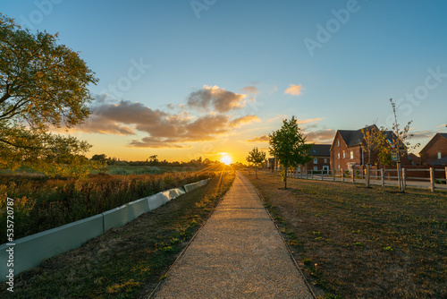 Empty walkway path at sunset near new build housing area in southern England