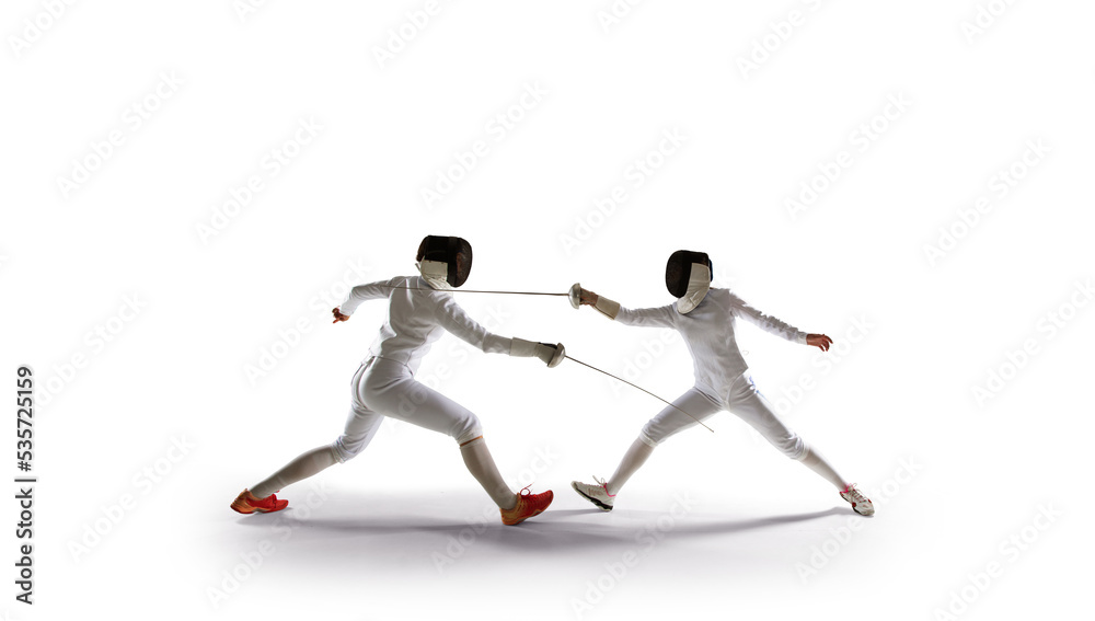Two female fencing athletes fight isolated on white