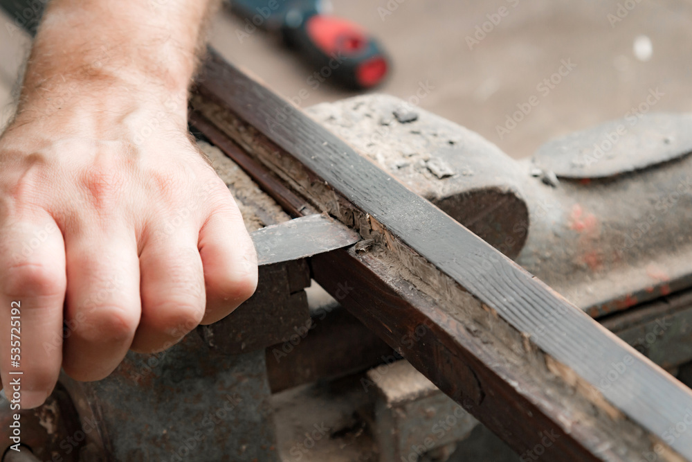 Man assembling furniture and fixing it - hobby garage concept. Man assembling furniture and fixing it - hobby garage concept.