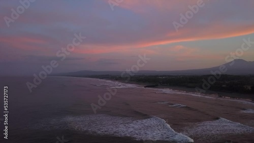 Pink sky, purple ocean sunrise over Kuta Mandalika beach on Lombok photo