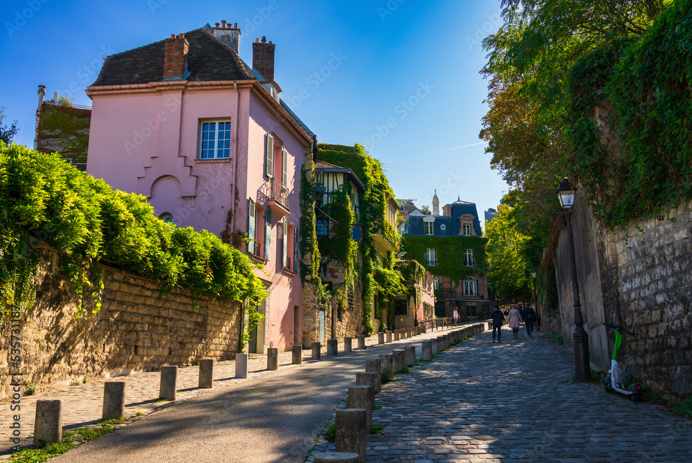 View of old street in quarter Montmartre in Paris, France. Cozy cityscape of Paris. Architecture and landmarks of Paris