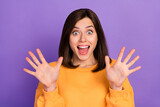 Closeup photo of young adorable cute pretty girlish woman wear orange shirt boo scary you halloween event palms up isolated on purple color background