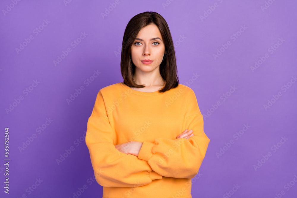 Close up photo of stunning lady nice haircut hairdo dressed orange sweatshirt arm folded isolated on purple color background Close up photo of stunning lady nice haircut hairdo dressed orange sweatshirt arm folded isolated on purple color background