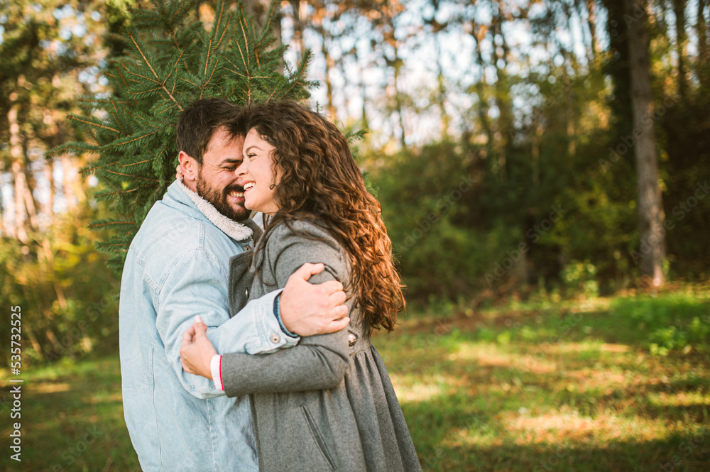 Young happy couple is preparing for the New Year holidays Young happy couple is preparing for the New Year holidays