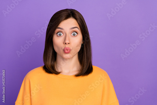 Closeup photo of young gorgeous nice pretty lady wear yellow sweater lovely coquette pouted lips looking you isolated on bright violet color background