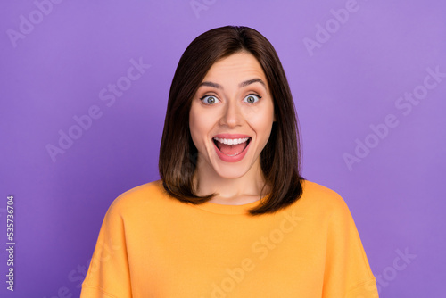 Closeup photo of young pretty girlish adorable lady bob brown hair reaction emotion open mouth toothy shocked winter sale isolated on violet color background