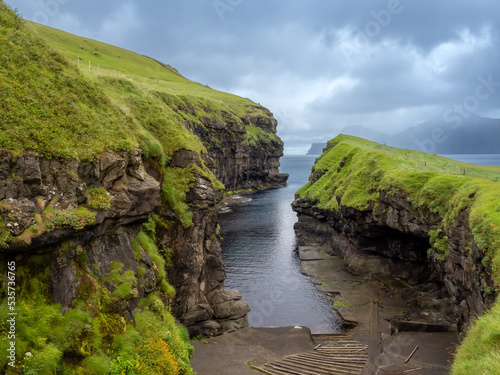Gjógv (gorge) village on the northeast tip of the island of Eysturoy, in the Faroe Islands. Named after sea gorge running from the village to the ocean. Faroe Islands