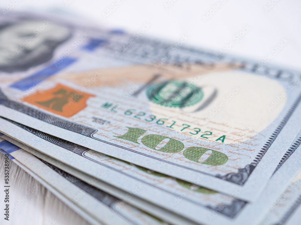 Close up, American one hundred dollar banknote. Selective focus at number 100.. Close up, American one hundred dollar banknote. Selective focus at number 100..
