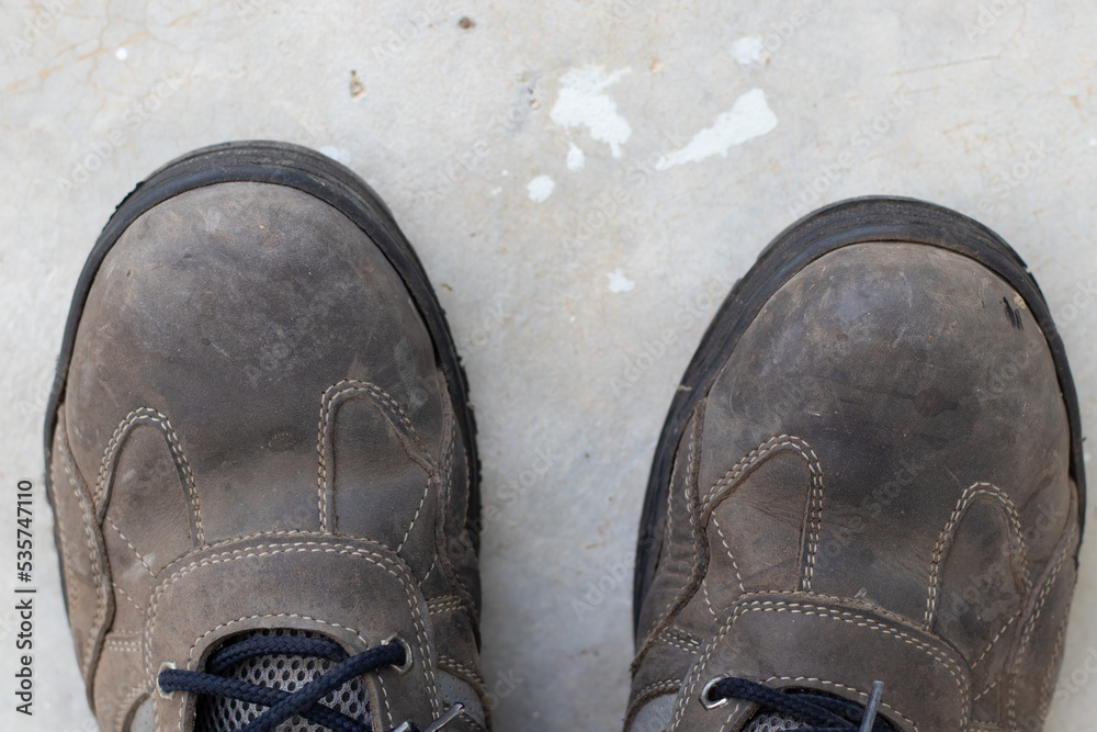 Heavy duty safety shoes, dirty shoes Stock Photo | Adobe Stock