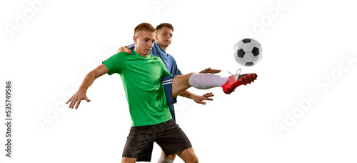 Fototapeta Naklejka Na Ścianę i Meble -  Two soccer players in action, motion on green grass flooring isolated over white background. Concept of global sport, championship, competition, football match