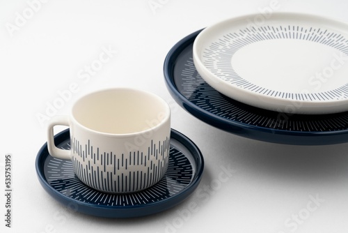 Fotografi Set of blue and white luxury ceramic kitchen utensils on a white background
