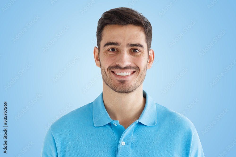 Portrait of smiling handsome man in blue polo shirt Portrait of smiling handsome man in blue polo shirt