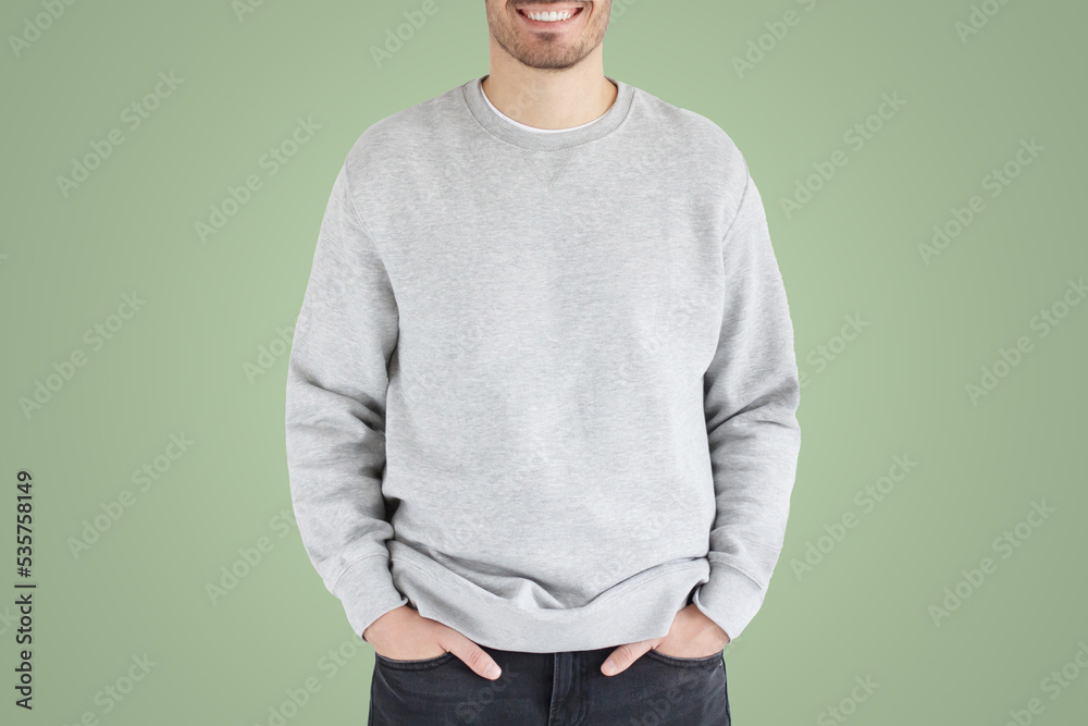 No face photo of man in gray sweatshirt, standing isolated on green background No face photo of man in gray sweatshirt, standing isolated on green background