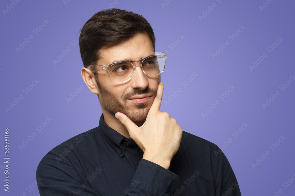 Thoughtful pensive businessman isolated on purple Thoughtful pensive businessman isolated on purple
