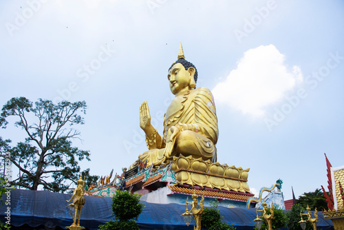 Big buddha statue of Wat Maniwong for thai people travel visit and respect praying blessing holy worship mystical in Mani Wong temple at Nakhonnayok city on September 6  2022 in Nakhon Nayok Thailand