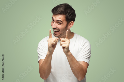 Man showing small size of something, little reduced price, satisfied with fact photo