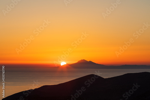 Amazing colourful sunset from Folegandros Island with the Aegean sea. Cyclades of Greece.