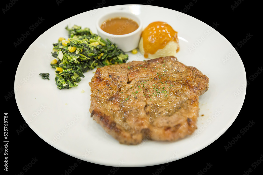 Top view of pork Steak with Black Pepper on a white plate, focus selective Top view of pork Steak with Black Pepper on a white plate, focus selective