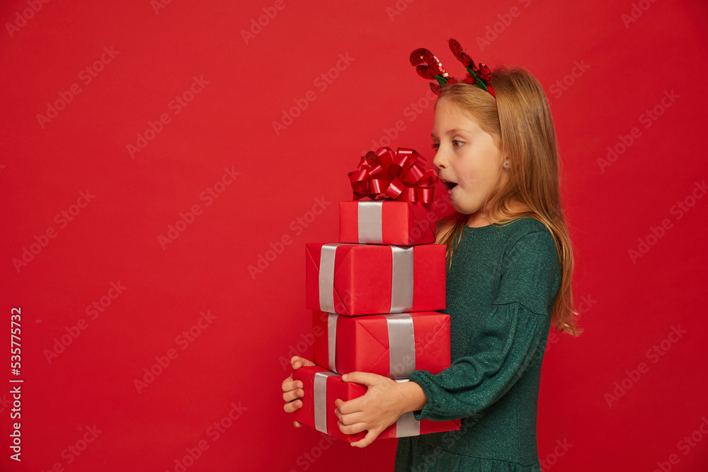 Smiling funny child (kid, girl) in Reindeer Hairband Smiling funny child (kid, girl) in Reindeer Hairband