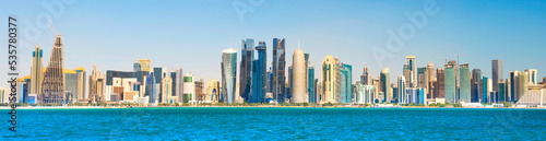 Foto Modern city downtown with skyscrapers, view from sea bay