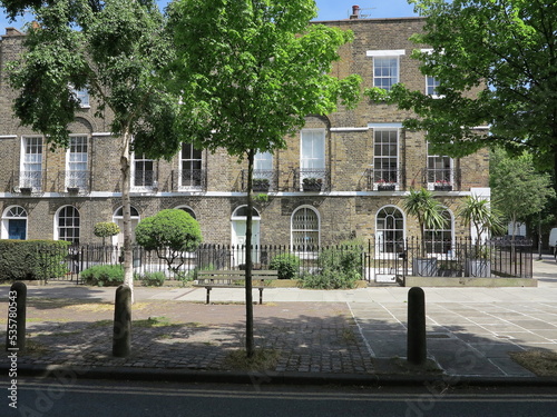 London Cloudesley Road Street View with House Facades and Green Trees, UK photo