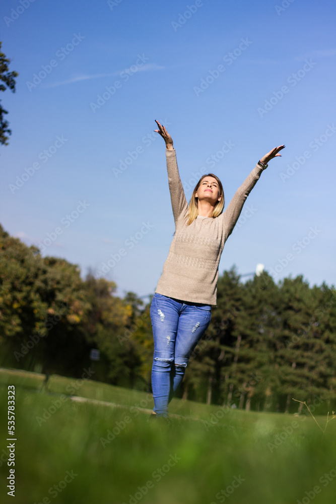 Young woman in sunny autumn forest Young woman in sunny autumn forest