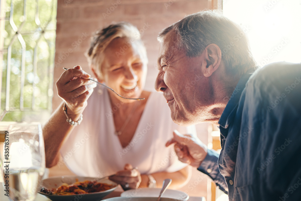 Couple, love and food with a senior man and woman on a date in a restaurant while eating on holiday. Travel, romance and dating with an elderly male and female pensioner enjoying a meal together Couple, love and food with a senior man and woman on a date in a restaurant while eating on holiday. Travel, romance and dating with an elderly male and female pensioner enjoying a meal together