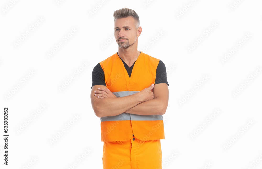 confident builder man wearing working reflective vest. studio shot of man builder. confident builder man wearing working reflective vest. studio shot of man builder.