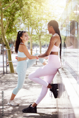 Fitness, health and friends stretching before outdoor run or cardio workout together in nature. Happy, motivation and interracial women outside for exercise with wellness, healthy and sport lifestyle