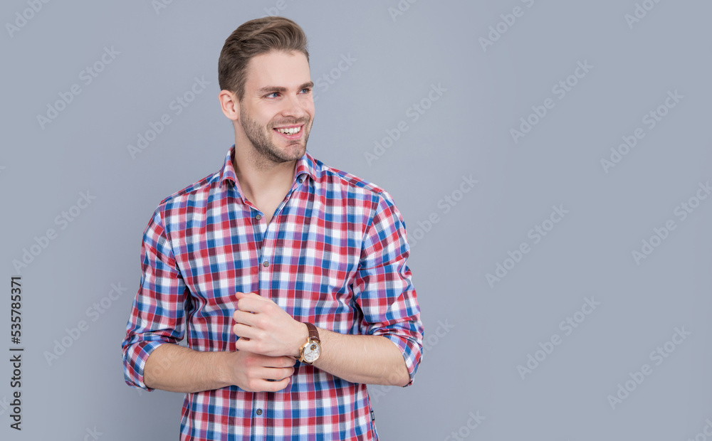 studio shot of man, copy space. caucasian man having stubble. handsome man in checkered shirt studio shot of man, copy space. caucasian man having stubble. handsome man in checkered shirt
