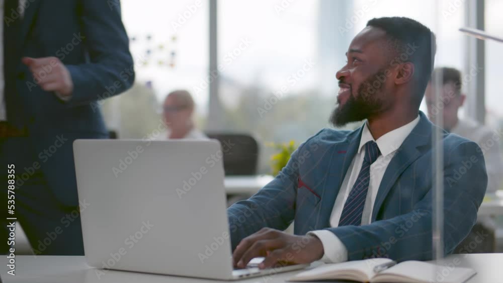 Businessman congratulate colleague with success and tap on shoulder in office Businessman congratulate colleague with success and tap on shoulder in office