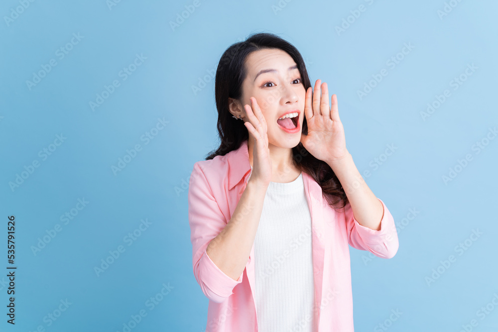 Portrait of young Asian woman on background Portrait of young Asian woman on background