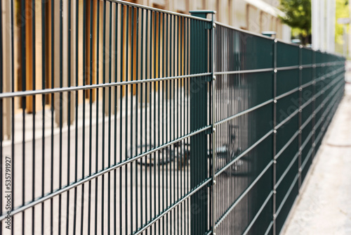 Wallpaper Mural Sectional metal Mesh Fence. Steel grating fence. Sectional fencing installation.  Torontodigital.ca