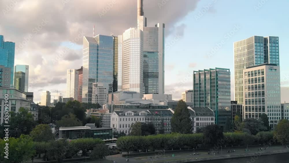 Frankfurt, Germany - September 10, 2019: Panoramic sunset view of city financial skyline from above the Main river Frankfurt, Germany - September 10, 2019: Panoramic sunset view of city financial skyline from above the Main river