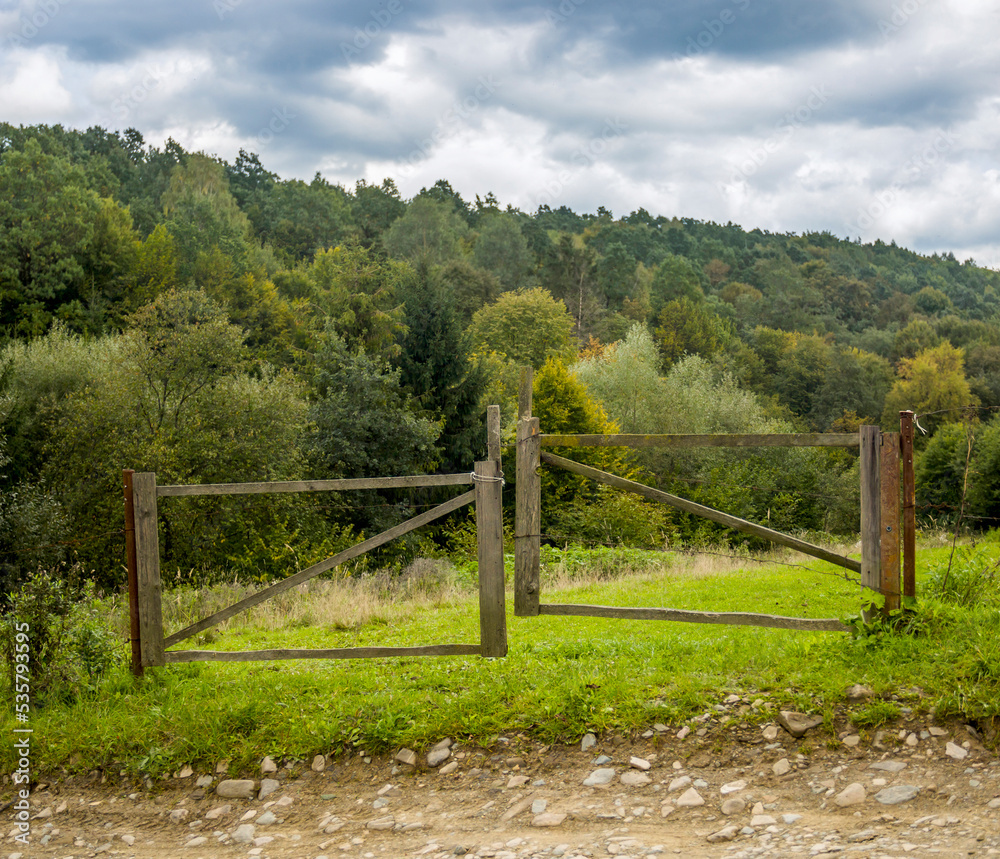 wide wooden gate in the Carpathian village