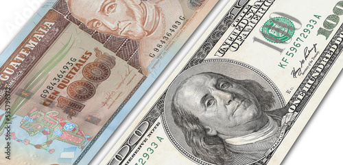Guatemalan quetzal and US 100 bill. Close up Guatemalan banknotes and US banknotes