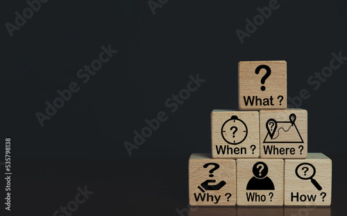 5W1H Analytical thinking with 5W1H,Root cause analysis concept.,What,When,Where,Why,Who,How text and icon on wooden cube over black background with copyspace for put text or logo.