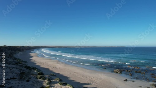 Wallpaper Mural Drone flyover Beautiful sandy beach with small waves coming to shore, Berry Bay, Australia Torontodigital.ca
