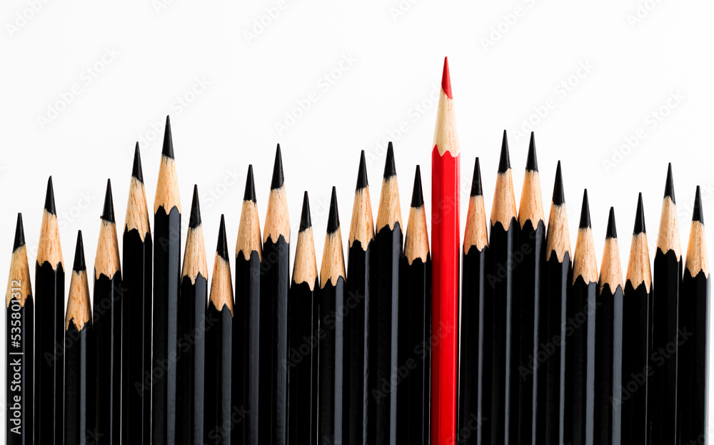 Red pencil standing out from the crowd Red pencil standing out from the crowd