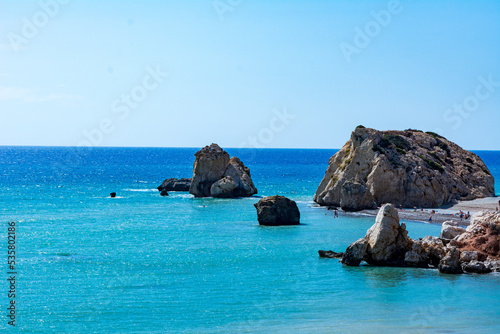 Beautiful summer coastal view with little rocks near the beach