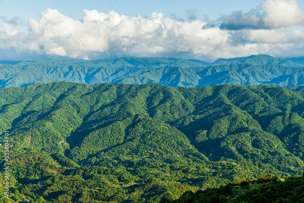 Layers of magnificent mountains and clear clouds background in Taiwan.